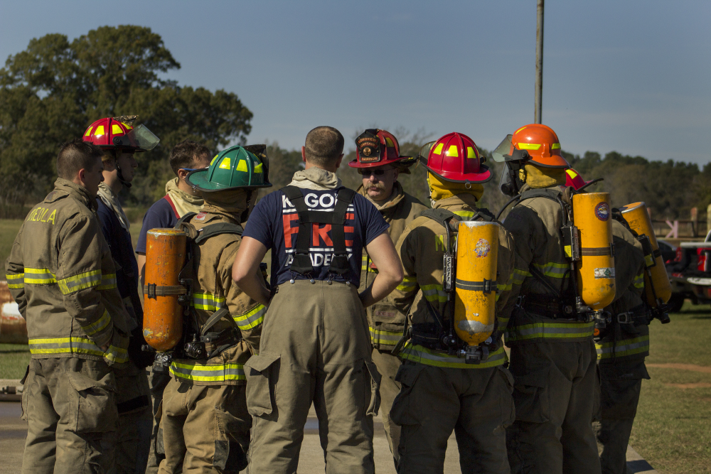Fire Academy students listening to an instructor